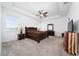 Main bedroom with a king-size bed and ensuite bathroom at 3052 Ella Way, Saint Cloud, FL 34771