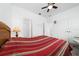 Bedroom featuring a red and white striped comforter at 3052 Ella Way, Saint Cloud, FL 34771