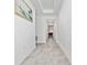 View down a long entryway with tile floors at 3052 Ella Way, Saint Cloud, FL 34771