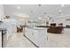 Open kitchen with island and view of dining and living area at 3052 Ella Way, Saint Cloud, FL 34771
