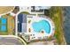 Community pool with plenty of lounge chairs for relaxation at 3052 Ella Way, Saint Cloud, FL 34771