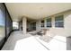 Spacious screened patio with fire pit and seating area at 3052 Ella Way, Saint Cloud, FL 34771