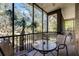 Spacious screened porch with glass-top table and chairs at 308 Rum Run # B35/U308, Davenport, FL 33897