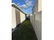 Side yard with grassy area and fence at 3309 Sonder Dr, Davenport, FL 33896