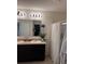 Double vanity bathroom with updated light fixtures and a shower at 3309 Sonder Dr, Davenport, FL 33896