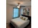 Bedroom with double bed, ceiling fan and decor at 3309 Sonder Dr, Davenport, FL 33896