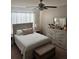 Spacious bedroom with a queen-size bed, dresser, and bedside tables at 3309 Sonder Dr, Davenport, FL 33896
