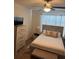 Bright bedroom with a full-size bed, dresser, and bedside tables at 3309 Sonder Dr, Davenport, FL 33896