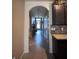 Bright and airy entryway with tile floors and an arched doorway leading into the home at 3309 Sonder Dr, Davenport, FL 33896