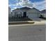 One-story home with two-car garage, landscaping, and a neutral color palette at 3309 Sonder Dr, Davenport, FL 33896