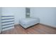 Cozy bedroom featuring wood-look floors and a double bed at 3643 Julius Estates Blvd, Winter Haven, FL 33881