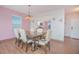 Dining room with a dark wood table and six off-white chairs at 3643 Julius Estates Blvd, Winter Haven, FL 33881