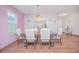 Dining room with a dark wood table and six off-white chairs at 3643 Julius Estates Blvd, Winter Haven, FL 33881