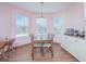 Charming dining room with a wooden table and light pink walls at 3643 Julius Estates Blvd, Winter Haven, FL 33881