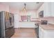 Modern kitchen with stainless steel appliances and light cabinets at 3643 Julius Estates Blvd, Winter Haven, FL 33881