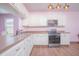 Modern kitchen featuring stainless steel appliances and light cabinets at 3643 Julius Estates Blvd, Winter Haven, FL 33881