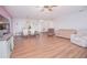 Bright living room with hardwood floors, dining area, and comfy seating at 3643 Julius Estates Blvd, Winter Haven, FL 33881