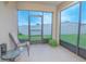 Relaxing screened porch with tiled floor and backyard view at 3643 Julius Estates Blvd, Winter Haven, FL 33881
