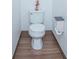 Small toilet area with wood-look flooring at 3643 Julius Estates Blvd, Winter Haven, FL 33881
