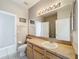 Bathroom with light wood vanity and shower/tub combo at 370 Henley Cir, Davenport, FL 33896