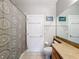 Bathroom with patterned shower curtain and a toilet at 370 Henley Cir, Davenport, FL 33896