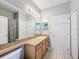 Clean bathroom with a large vanity and mirror at 370 Henley Cir, Davenport, FL 33896