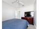 Main bedroom with a large dresser and TV at 370 Henley Cir, Davenport, FL 33896