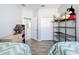 Bedroom with twin beds, shelving, and closet at 370 Henley Cir, Davenport, FL 33896