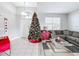 Bright entryway with a Christmas tree, tile flooring, and access to the living room at 370 Henley Cir, Davenport, FL 33896