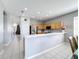 Modern kitchen with breakfast bar and stainless steel appliances at 370 Henley Cir, Davenport, FL 33896
