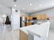 Modern kitchen with breakfast bar and stainless steel appliances at 370 Henley Cir, Davenport, FL 33896
