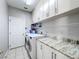 Laundry room with washer, dryer, and cabinets at 370 Henley Cir, Davenport, FL 33896