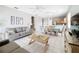 Bright living room features a comfy sofa and adjacent dining area at 370 Henley Cir, Davenport, FL 33896