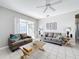 Cozy living room with comfy sofas and access to a patio at 370 Henley Cir, Davenport, FL 33896