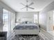 Bright main bedroom with king-size bed and access to a patio at 370 Henley Cir, Davenport, FL 33896