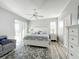 Main bedroom with king bed, ceiling fan and access to patio at 370 Henley Cir, Davenport, FL 33896