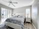 Main bedroom with king bed, ceiling fan and patio access at 370 Henley Cir, Davenport, FL 33896