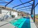 Relaxing pool and spa with screened patio and grill at 370 Henley Cir, Davenport, FL 33896