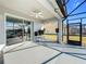 Screened patio with ceiling fan and backyard view at 370 Henley Cir, Davenport, FL 33896