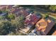 Community view, showing houses with tile roofs and pools at 384 Orange Cosmos Blvd, Davenport, FL 33837