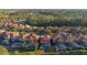 Community overview, showcasing houses with tile roofs and pools at 384 Orange Cosmos Blvd, Davenport, FL 33837