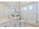 Clean bathroom with a shower, toilet and vanity at 384 Orange Cosmos Blvd, Davenport, FL 33837