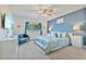 Primary bedroom with a king bed and blue decor at 384 Orange Cosmos Blvd, Davenport, FL 33837
