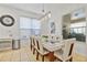 Bright dining room featuring a large table with six chairs, and a light fixture at 384 Orange Cosmos Blvd, Davenport, FL 33837