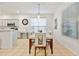 Bright dining room with a table for six, adjacent to the kitchen at 384 Orange Cosmos Blvd, Davenport, FL 33837