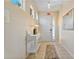 Light and airy entryway with a console table and mirror at 384 Orange Cosmos Blvd, Davenport, FL 33837