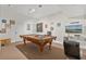 Game room with a pool table, dartboard and TV at 384 Orange Cosmos Blvd, Davenport, FL 33837