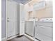 Laundry room with washer, dryer, and shelving at 384 Orange Cosmos Blvd, Davenport, FL 33837