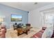 Living room with leather sofas and large flat screen TV at 384 Orange Cosmos Blvd, Davenport, FL 33837