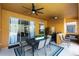 Covered patio with dining set and ceiling fan at 384 Orange Cosmos Blvd, Davenport, FL 33837
